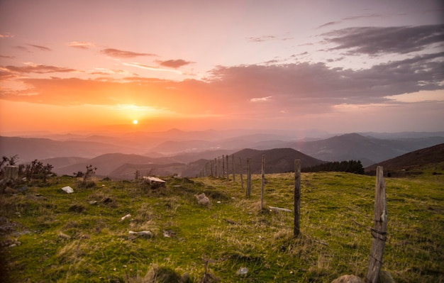 sun setting down over the green hills of the Basque Country