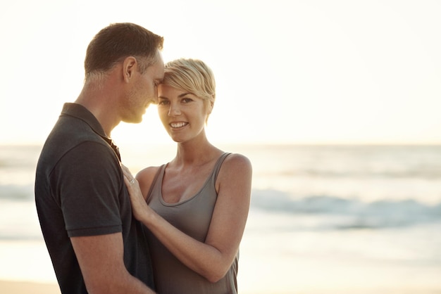 The sun shines on their love Shot of a mature couple enjoying a day at the beach