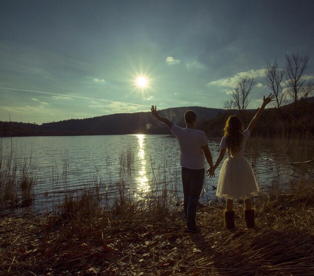 Sun shining over lake