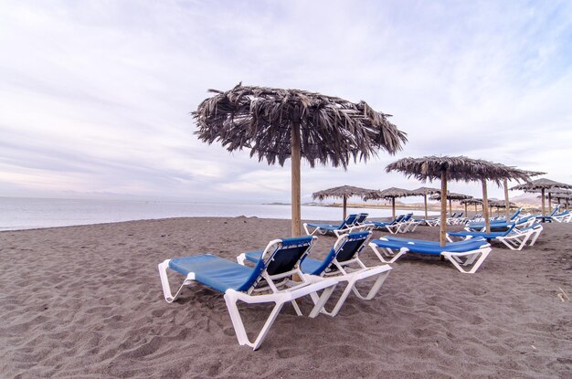 Sunbeds and Umbrella on a Tropical Beach