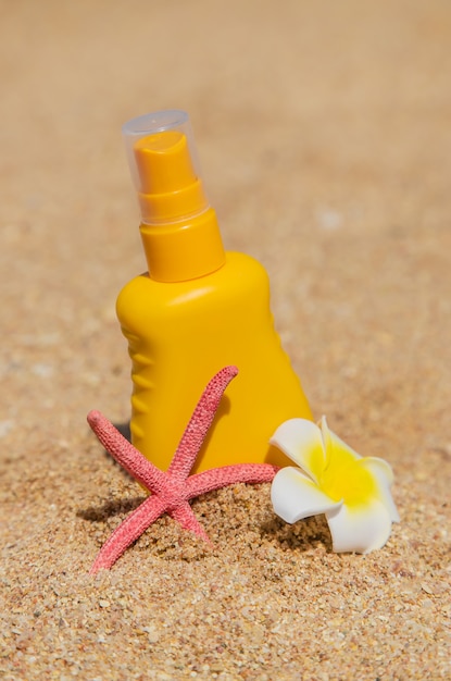 Sunblock on the beach. Sun protection. Selective focus.