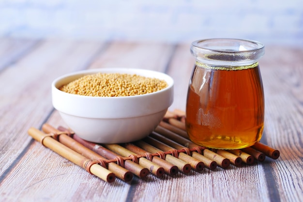 Sunflower coking oil and seeds in a container on table