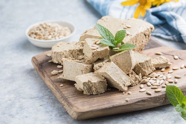 Photo sunflower halva close-up. halva briquette isolated on white background.