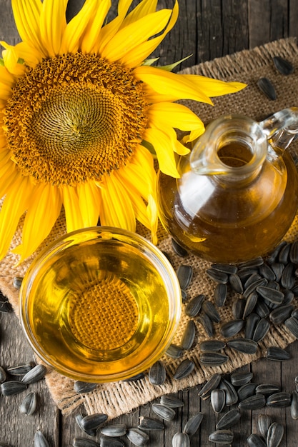 Sunflower oil and sunflower seeds on a small sack