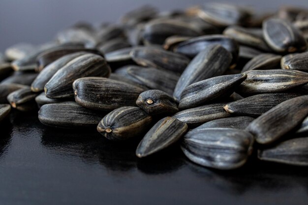 Sunflower seed on a black wooden table