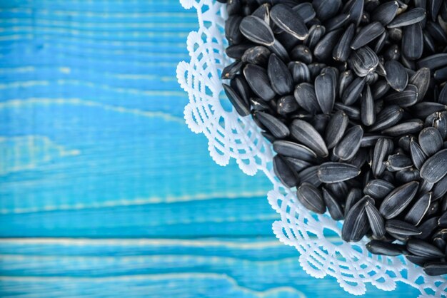 Sunflower seeds on a blue wooden background