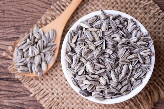 Sunflower seeds on wood table.