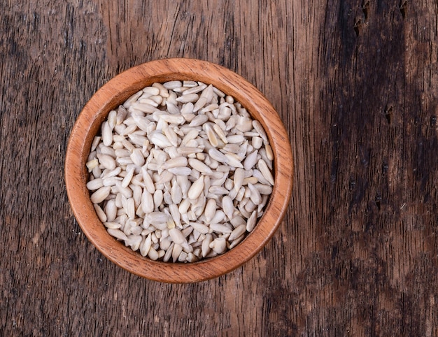 Sunflower seeds in wooden bowl