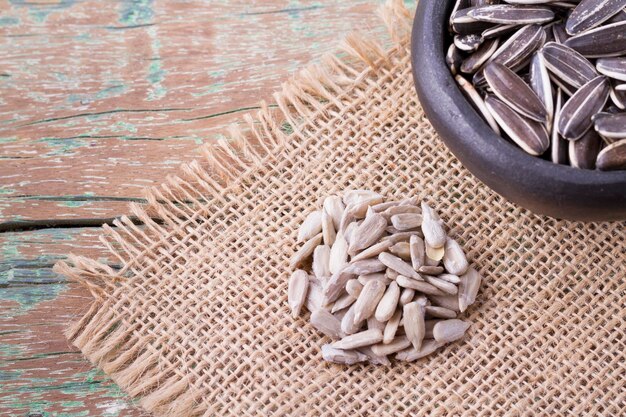 Sunflower seeds on the wooden table Helianthus annuus