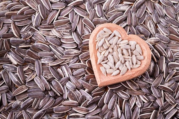 Sunflower seeds on the wooden table Helianthus annuus