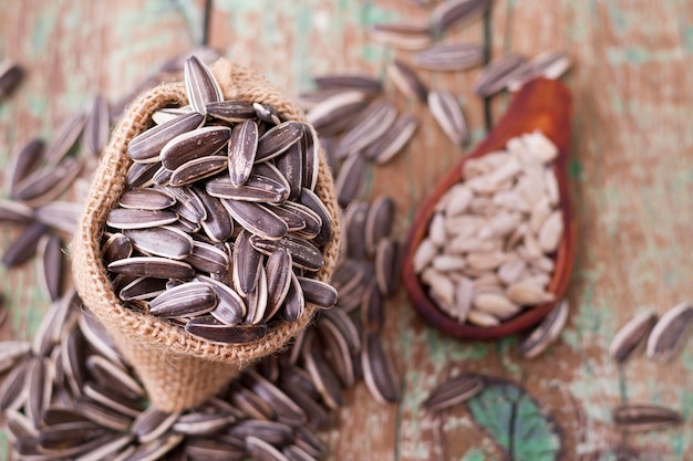 Sunflower seeds on the wooden table Helianthus annuus