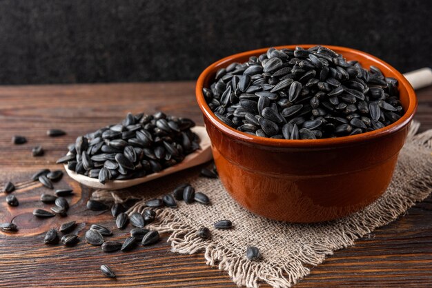 Sunflower seeds on wooden table.