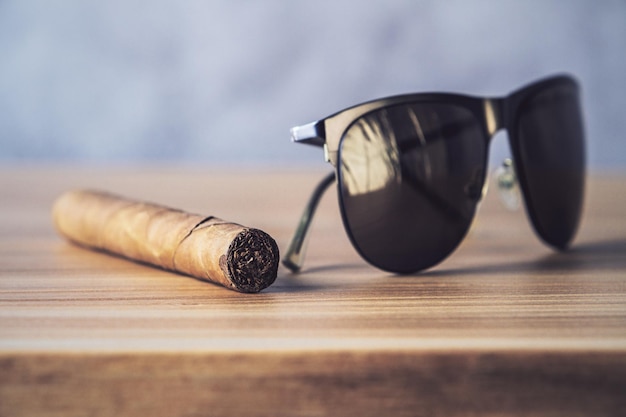 Sunglasses and cigar