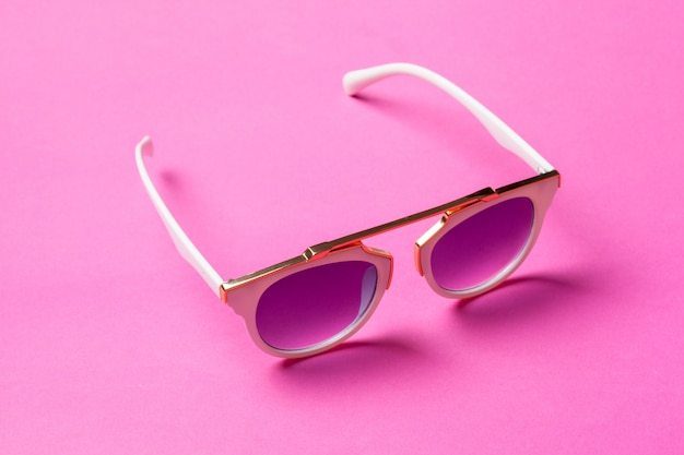 Sunglasses on pink