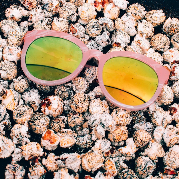 Sunglasses on the popcorn background Minimal fashion