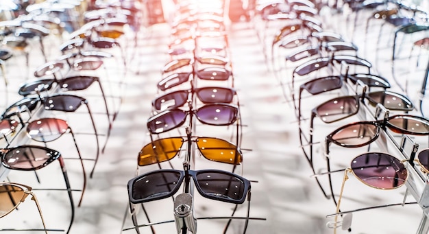 Sunglasses in a store Ssunglasses in the shop display shelves