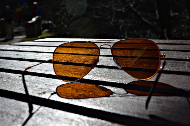 sunglasses on wooden table