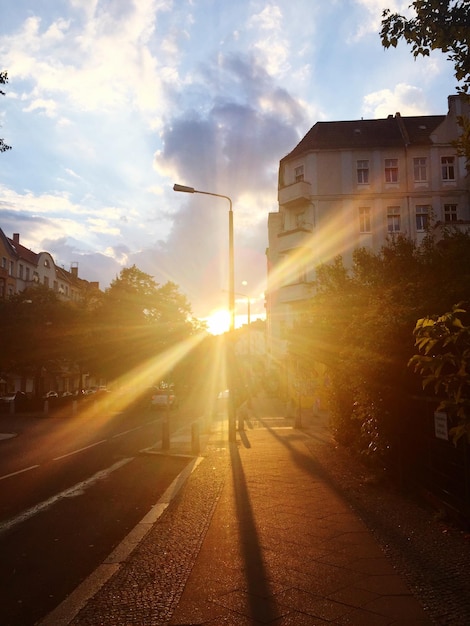 Sunlight falling on street in city during sunset