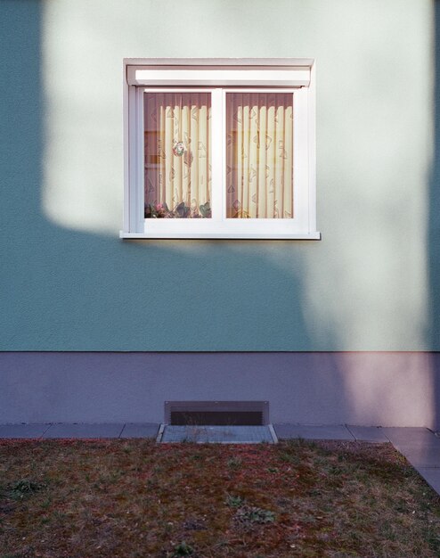 Sunlight falling on window and wall of building