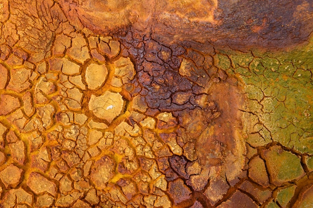 Sunlit cracked mineral soil in Rio Tinto