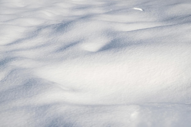 sunlit snow background on a clear winter day