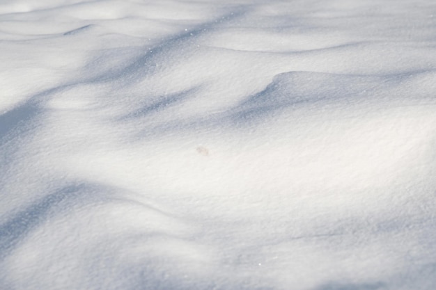 sunlit snow background on a clear winter day