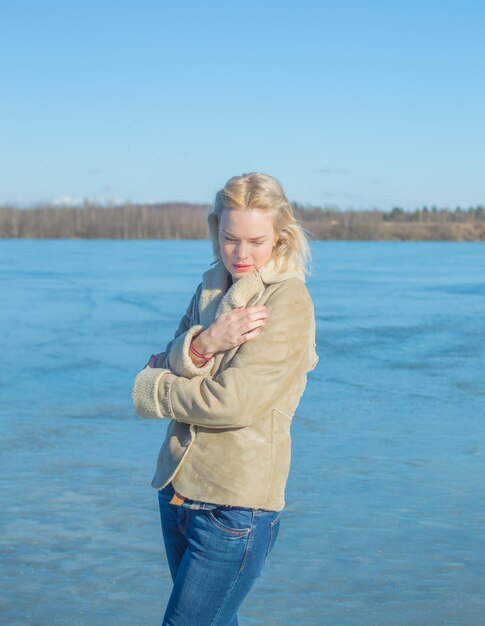 A Sunny day near the lake, and a beautiful girl wrapped in the wind.