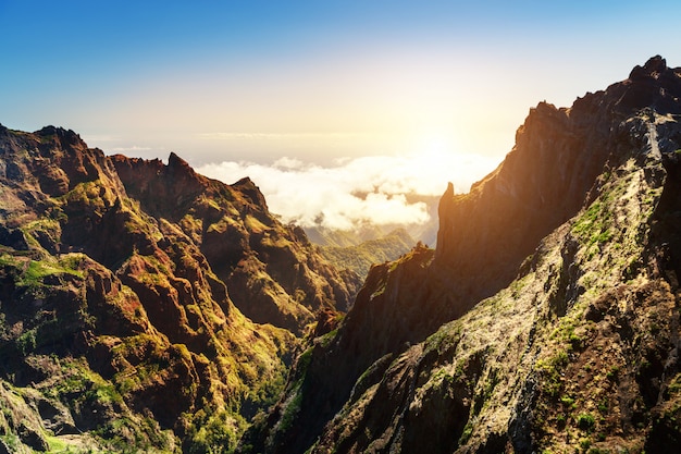 Sunny mountains in clouds