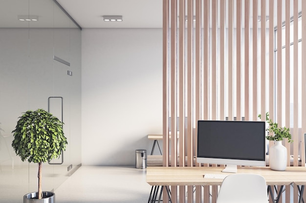 Sunny stylish office hall with wooden slatted partition between rows of work places glass transparent wall modern computers and wooden tables