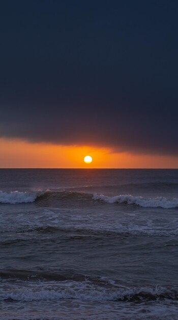 sunrise on the beach with colorful clouds