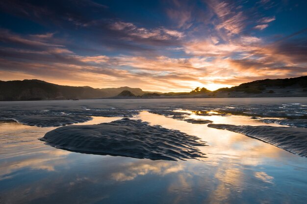 Sunrise above beach