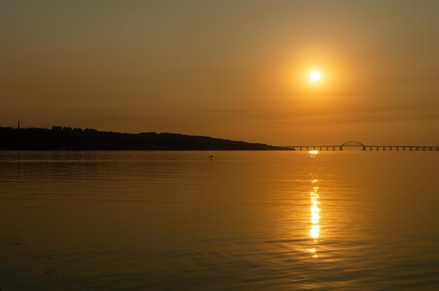 Sunrise over a calm sea.