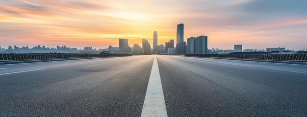 Photo sunrise over empty highway with cityscape