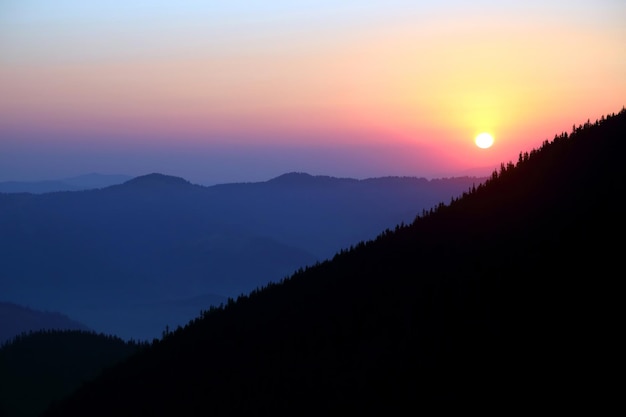 Sunrise in forest and mountainous areas