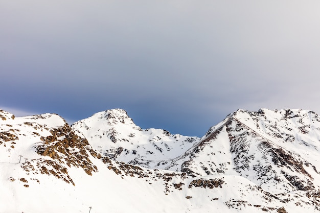 Sunrise in high mountain snowy landscape