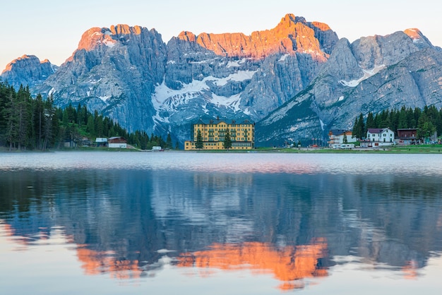 Sunrise at Misurina Lake in Dolomites mountains in Italy near Auronzo di Cadore with Sorapiss mountain in the background. South Tyrol, Dolomites