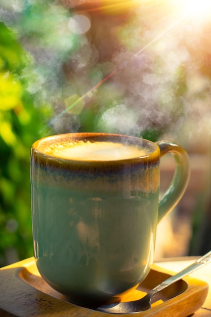 Sunrise morning coffee Morning cup of coffee on the against the backdrop of the rising sun sunrise