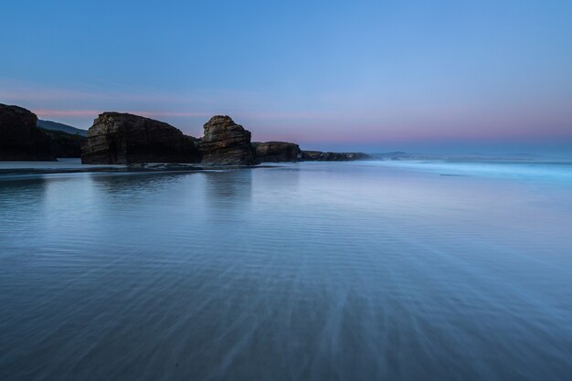 Sunrise at one of the most famous beaches in Spain, Las Catedrales!