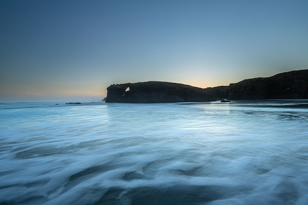 Sunrise at one of the most famous beaches in Spain, Las Catedrales!