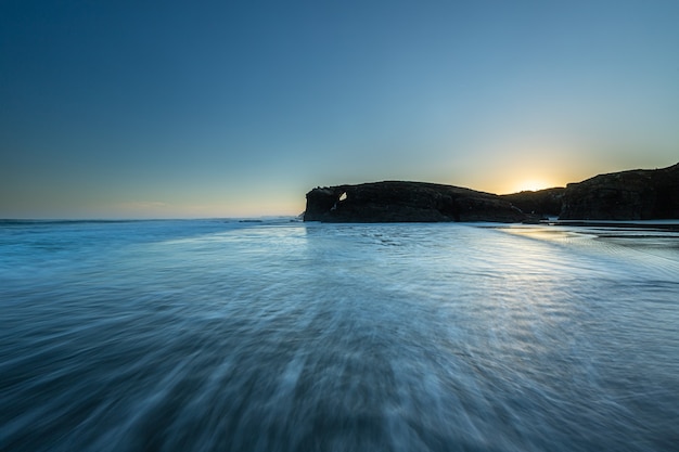 Sunrise at one of the most famous beaches in Spain, Las Catedrales!