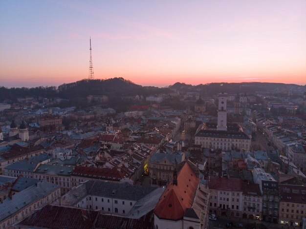 Sunrise overs old european city fist sun rays