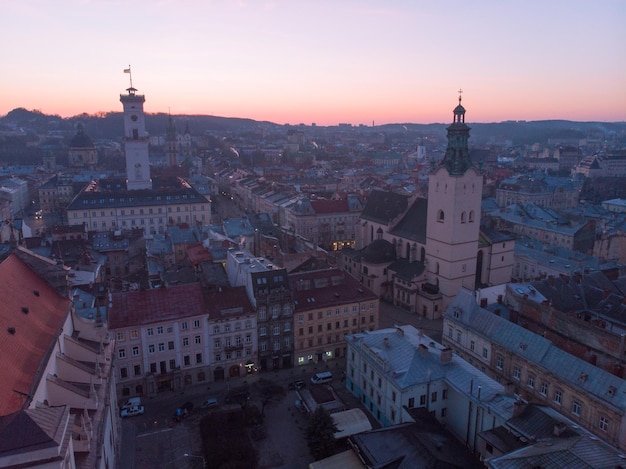 Sunrise overs old european city fist sun rays