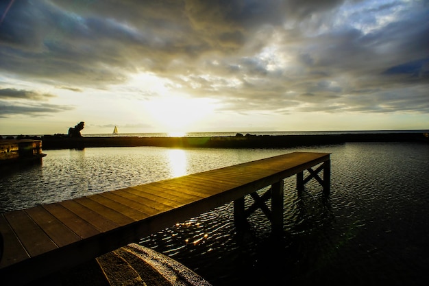 Sunrise on a Pier over Atlantic Ocean in Tenerife Canary Islands Spain