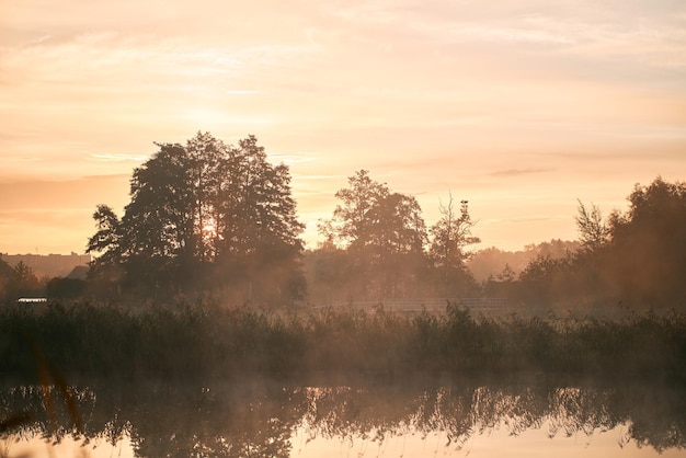 Sunrise over the river Concept of early waking and new beginning