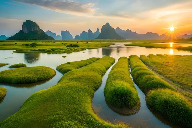 A sunrise over a river with mountains in the background