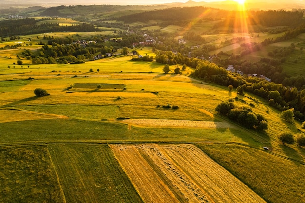 Sunrise over rolling hills and agriculture landscape