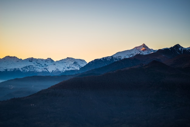 Sunrise at snowy mountains