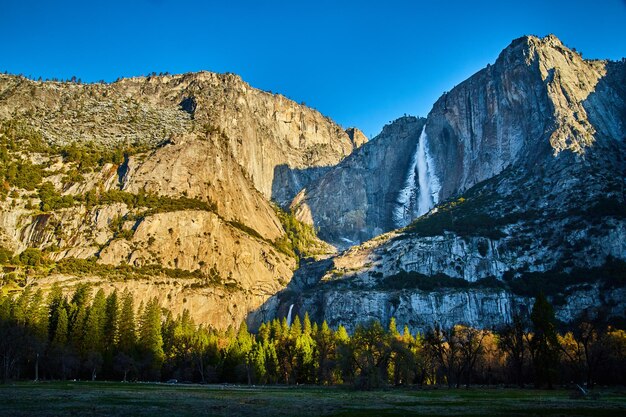 Sunrise at upper yosemite falls from valley floor