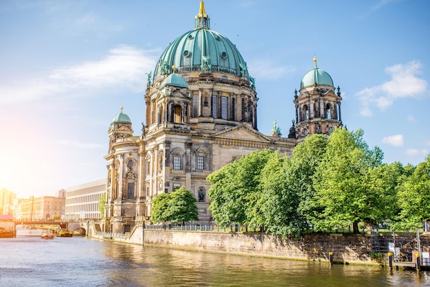 Sunrise view on the riverside with Dom cathedral in the old town of Berlin city