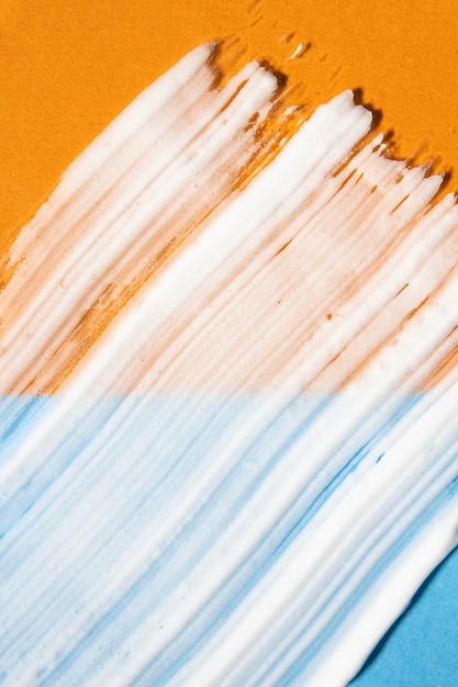Foto crema solare per il corpo su un prodotto spf multicolore di sfondo arancione e blu